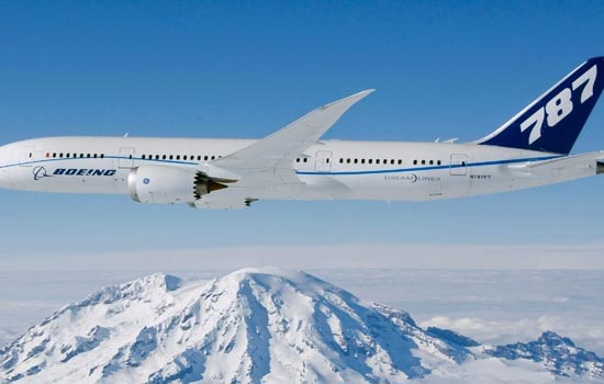 Boeing 787 flying high above snowy mountains